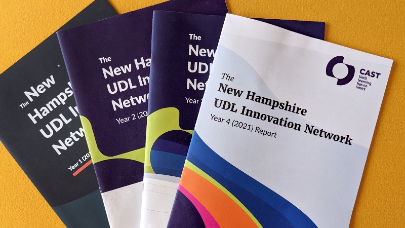 Photo of the four NH UDL Innovation Network annual reports displayed on a table