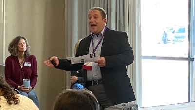 Photo of Niel Albero presenting at a learning event