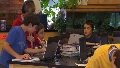 Photo of a group of students using laptops