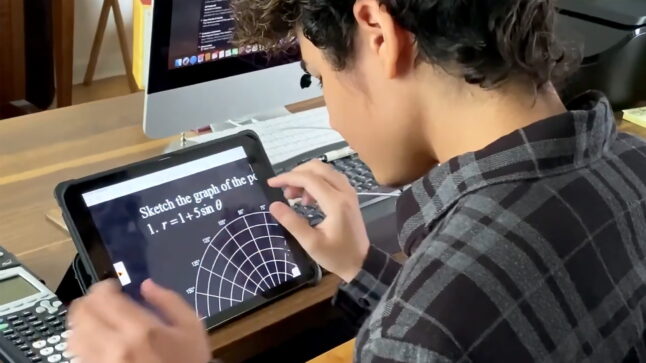student using a tablet to enlarge math diagrams