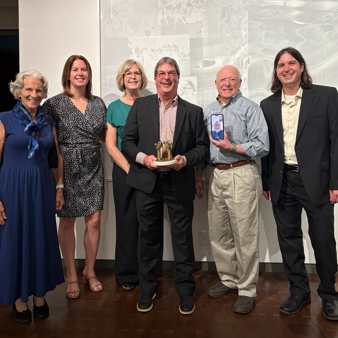 UDL Lifetime Achievement award recipient George Van Horn holding his award surrounded by CAST board members